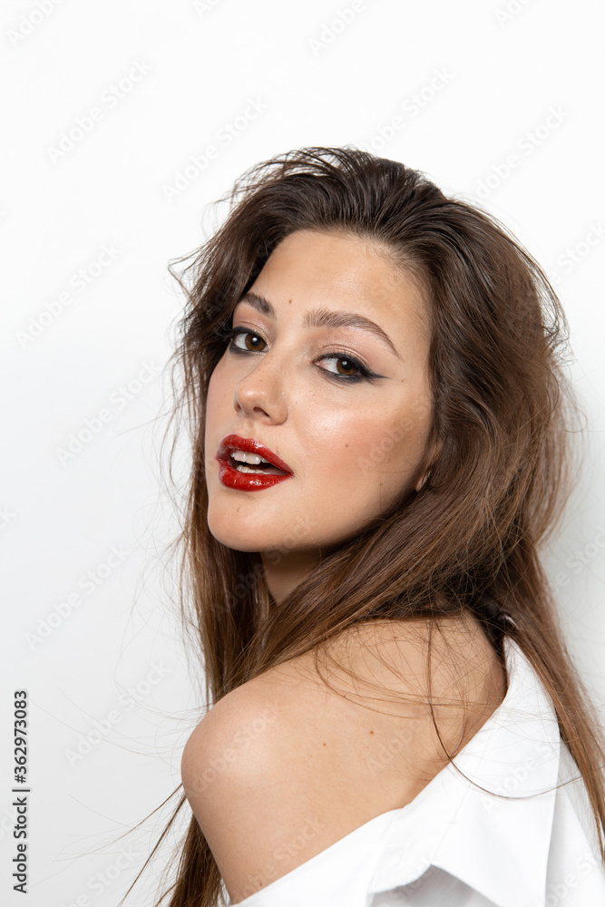 Beauty portrait of a girl with makeup with red lips Beauty portrait of a girl with makeup with red lips