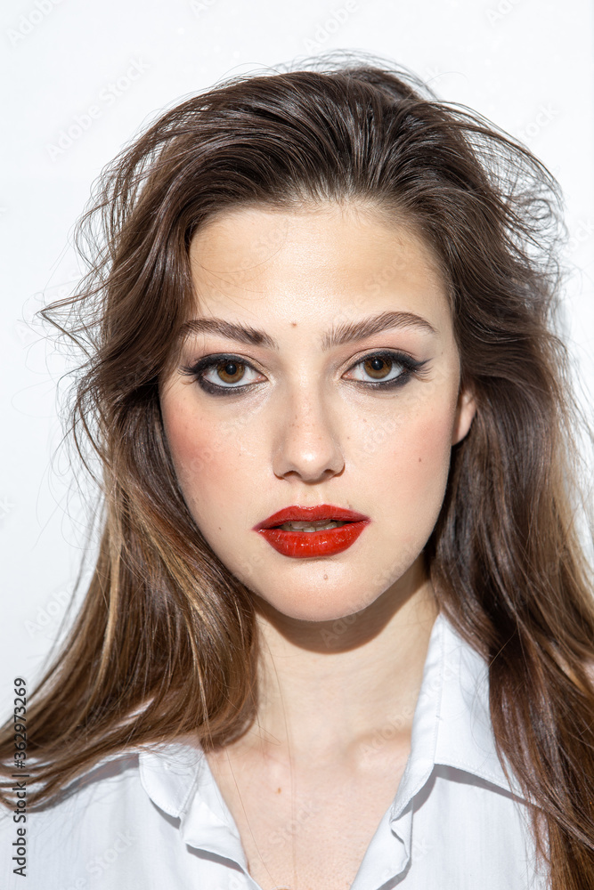 Beauty portrait of a girl with makeup with red lips Beauty portrait of a girl with makeup with red lips