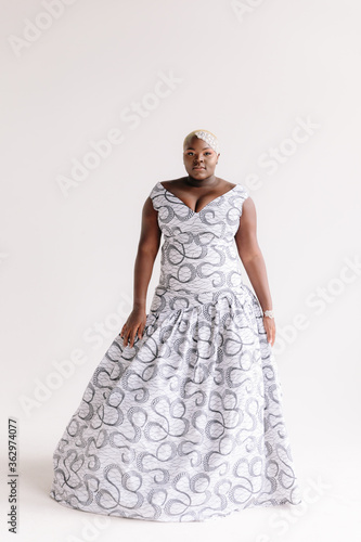 Afro-American plus size gorgeous woman modeling ethnic romantic gowns