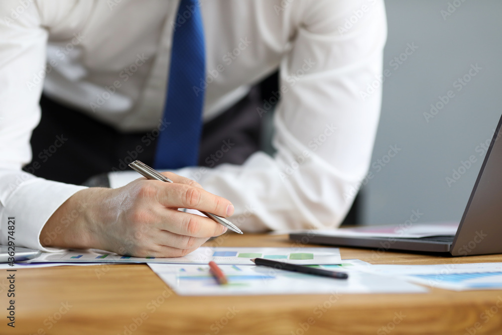 Man in business clothes leaned over table home Man in business clothes leaned over table home