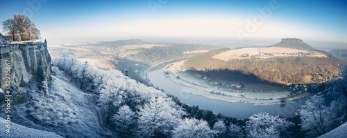 Festung Königstein fortress in saxony in winter with frozen landscape and river elbe