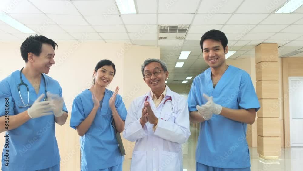 slow motion closeup hand applaud from doctor and nurse support,Clapping medical workers blur hospital background