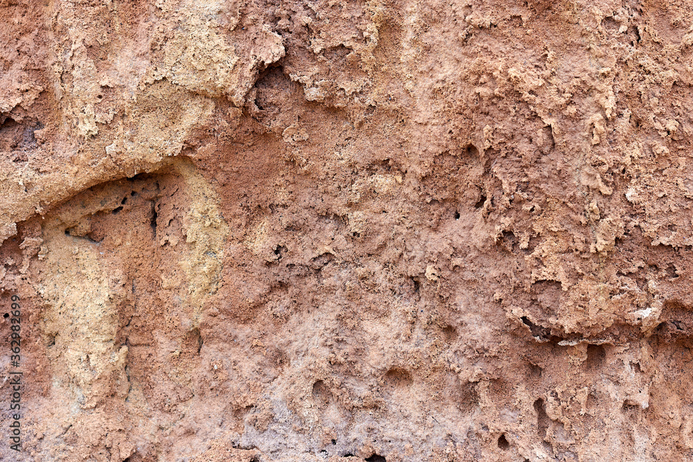 Texture of different layers of clay on the edge of a cliff. Closeup Texture of different layers of clay on the edge of a cliff. Closeup
