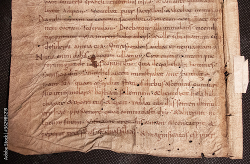 A ninth century manuscript from 1 Kings in the Bible written on vellum in a minuscule script.  photo