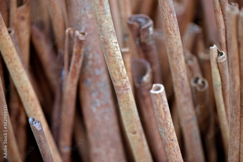 Closeup of cinnamon sticks at outdoor market stall Closeup of cinnamon sticks at outdoor market stall