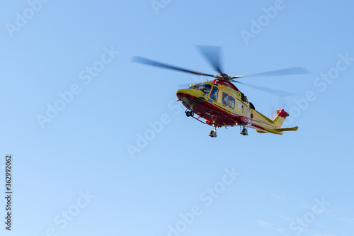 Rescue helicopter on a background of blue sky.  Landing medical helicopter. photo
