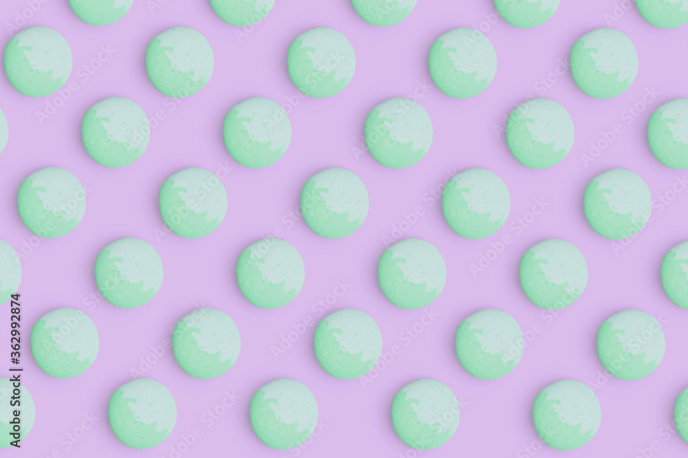 Macaroons pattern on colored background, a pattern of colorful french cookies macarons. Green french cookies macarons on purple background. Gift for congratulations. Macaroons pattern on colored background, a pattern of colorful french cookies macarons. Green french cookies macarons on purple background. Gift for congratulations.