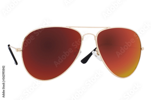 Sunglasses with a gold frame and brown lens isolated on white background.