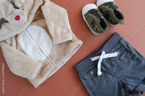 Kit of baby boy clothes. Apparel and footwear for infant.