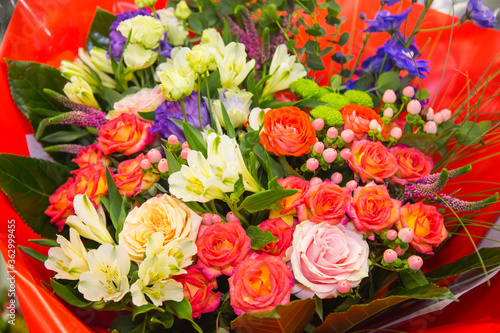 A bouquet of bright flowers roses gerberas irises  structures  and designs. Floriculture  agriculture.