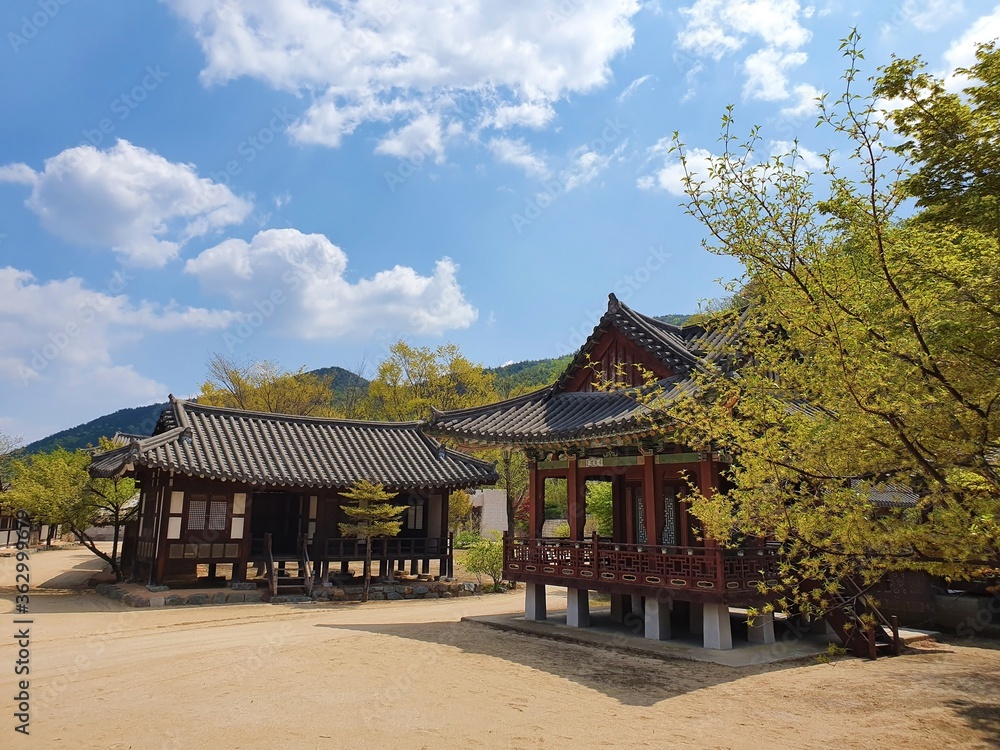 Traditional Korean buildings under a blue sky