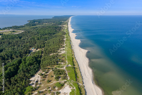 Beautiful view from the top of the Baltic  Vislin  spit. The sandy beach washed by the Baltic sea goes into the distance. Shot on a drone.