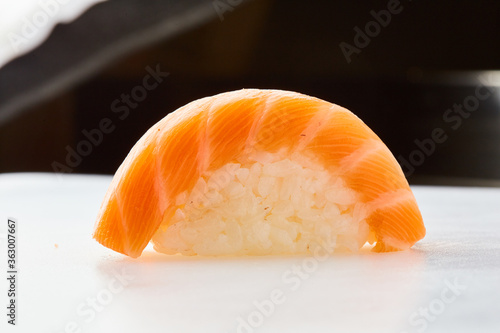 Classic sushi with salmon on white background. Traditional Japanese cuisine