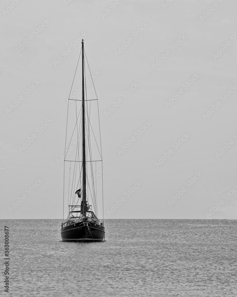 Yacht alone in the middle of the sea Black and White
