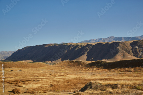 view of the Kopetdag mountains and the sun-scorched territory during the summer heat photo