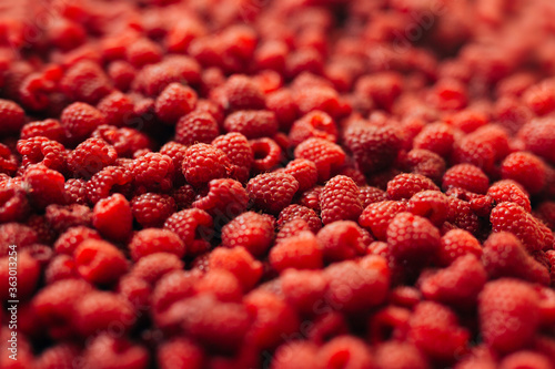 Close-up of red ripe raspberry berries, background and texture.