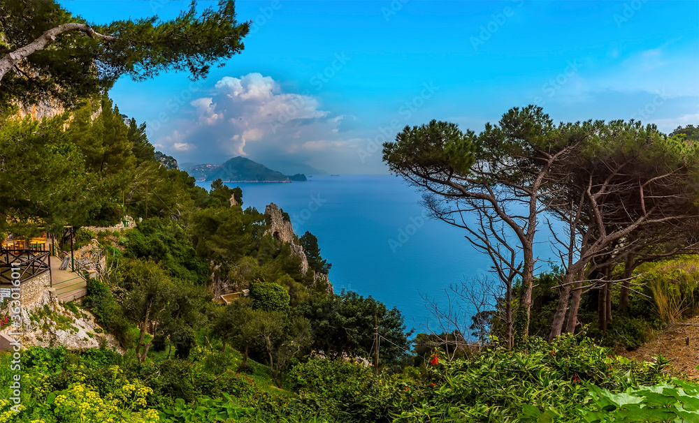 A panorama view of the natural arch and the Amalfi coast from the island of Capri, Italy