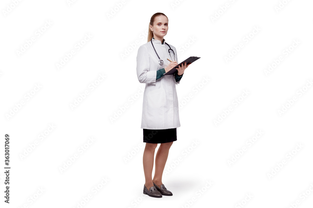Beautiful young woman doctor in a white medical coat looking at the camera. Beautiful young woman doctor in a white medical coat looking at the camera.