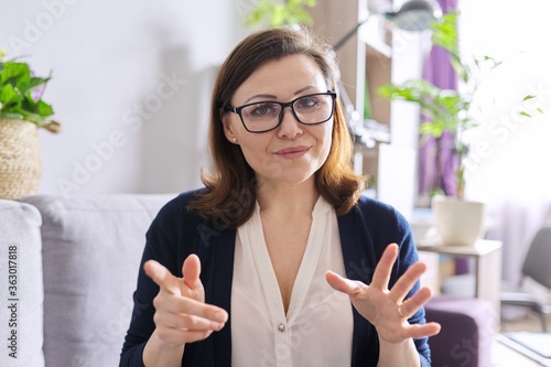 Quadro su tela Video call, video conference, business woman looking at webcam, closeup face