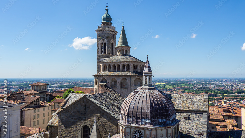 Bergamo, Italy. The old town. Amazing aerial view of the Basilica of Santa Maria Maggiore during a wonderful day. In the background the Po plain. Best of Italy