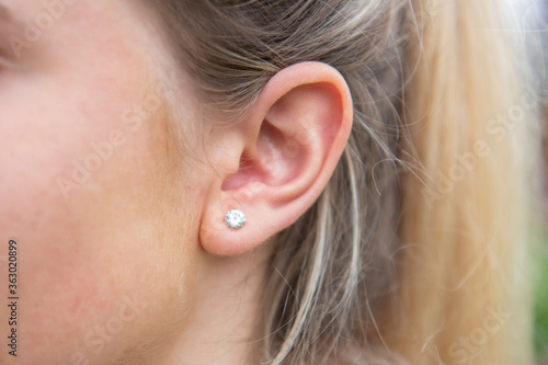 Firsts ear piercing on young female girl