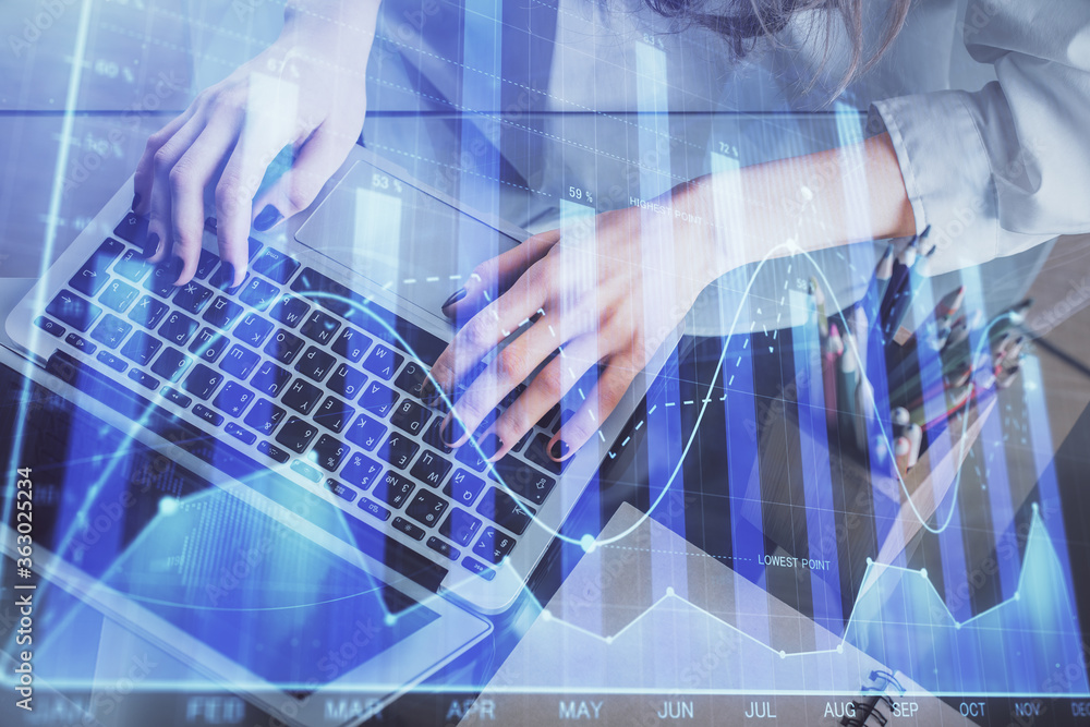 Double exposure of woman hands typing on computer and forex chart hologram drawing. Stock market invest concept. Double exposure of woman hands typing on computer and forex chart hologram drawing. Stock market invest concept.