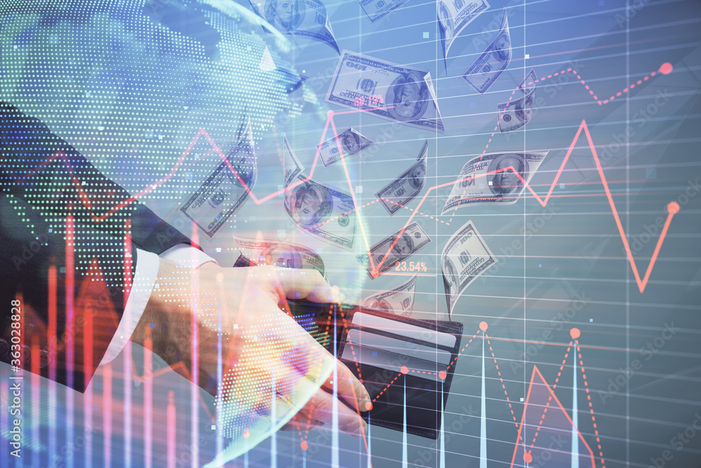 Multi exposure of financial graph drawing hologram and USA dollars bills and man hands. Analysis concept. Multi exposure of financial graph drawing hologram and USA dollars bills and man hands. Analysis concept.