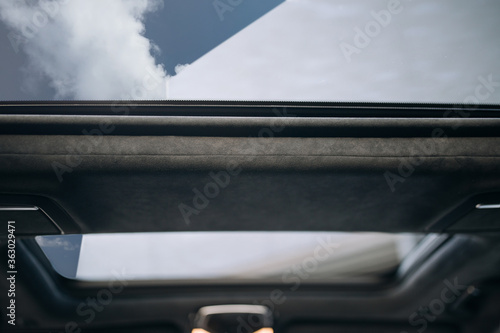Panoramic glass sun roof in the car © Moose