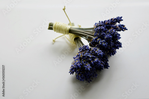 2 bundles of dried lavender on a white background