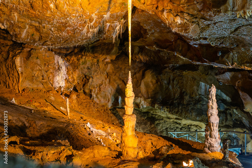 Long thin limestone stalactite and opposite stalagmite in Punkva Caves, Moravian Karst, Czech Republic
