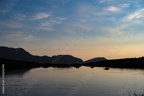 Flattop Mountain rests in the distance on an Alaskan evening