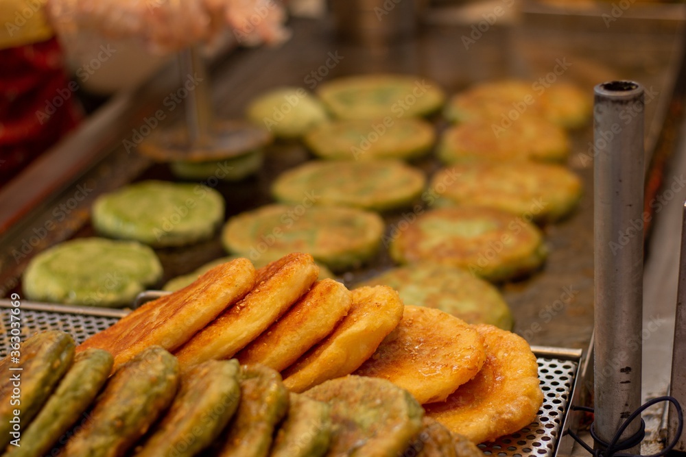 Selective focus shot of preparation of delicious Korean zucchini fritters