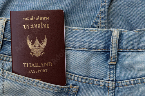 Top view Passport of Thailand in jeans pocket with copy space. Travel and tourism concept with Thai passport. 