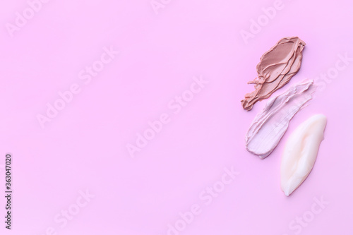 Samples of cream on color background