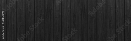 Panorama of Black wood texture background. Abstract dark wood texture on black wall. Aged wood plank texture pattern in dark tone