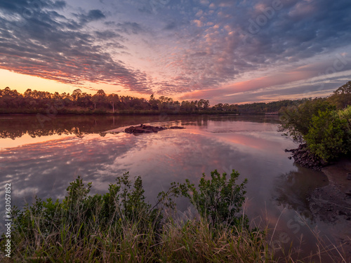 Beautiful Riverside Sunrise with Reflections