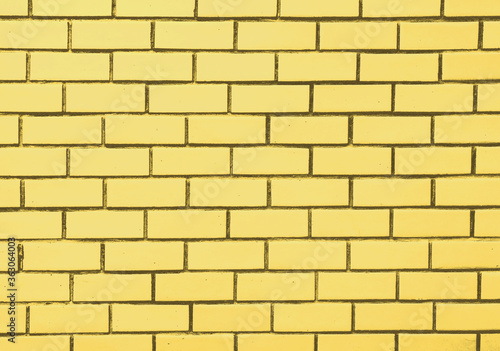 brick block wall of light yellow pastel color background