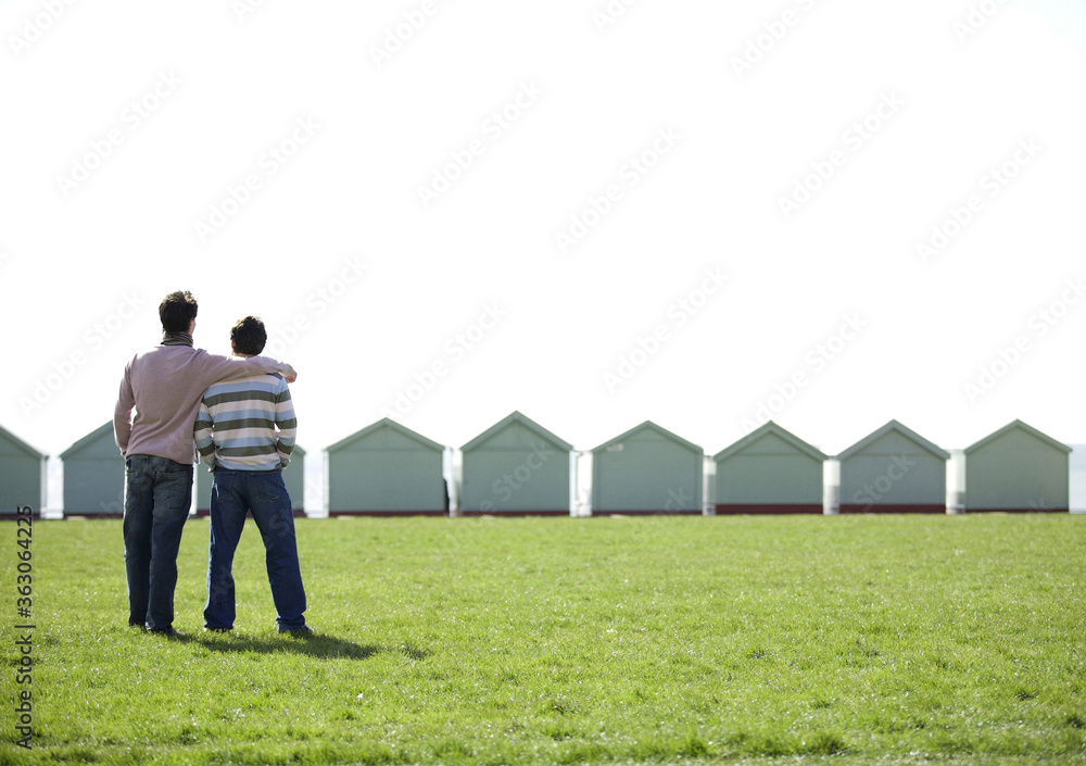 Man putting arm around his friend