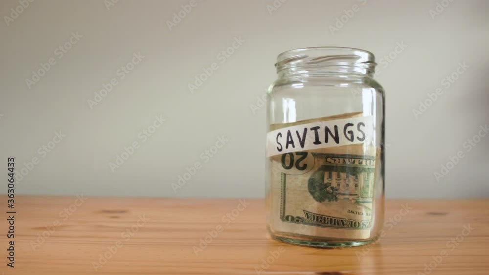 Man's hands withdrawing money US dollars cash from a Man's hands withdrawing money US dollars cash from a