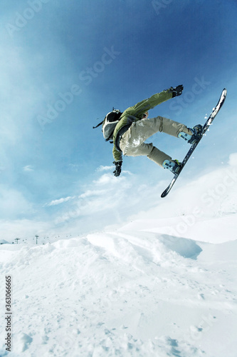Male snowboarder in air