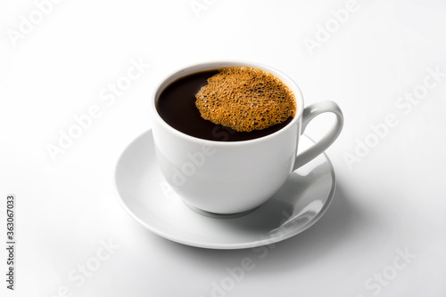 black coffee in a coffee cup top view isolated on white background.
