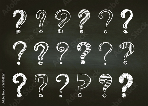 Set of hand drawn doodle question marks on a black board background, vector illustration.