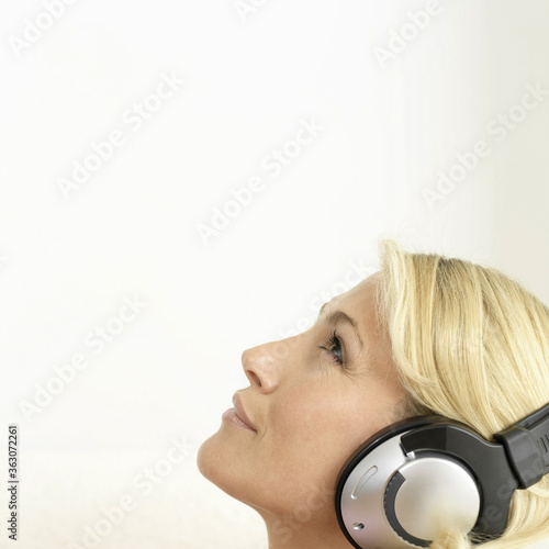 Woman listening to music on the headphones