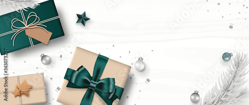 Christmas banner. Gift box craft style, Christmas ball, Star, pine branch, and confetti, isolated on white wooden background. Xmas background. Top view. Vector illustration.