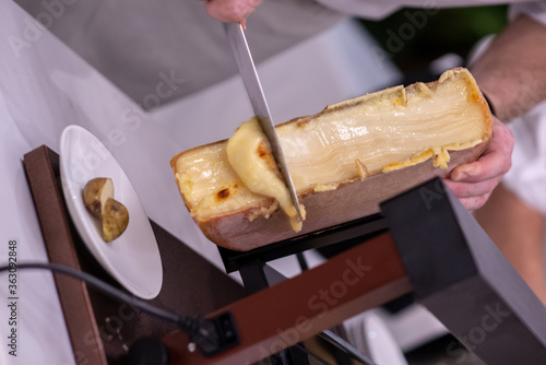 Swiss Raclette. Warm Melted Swiss Cheese