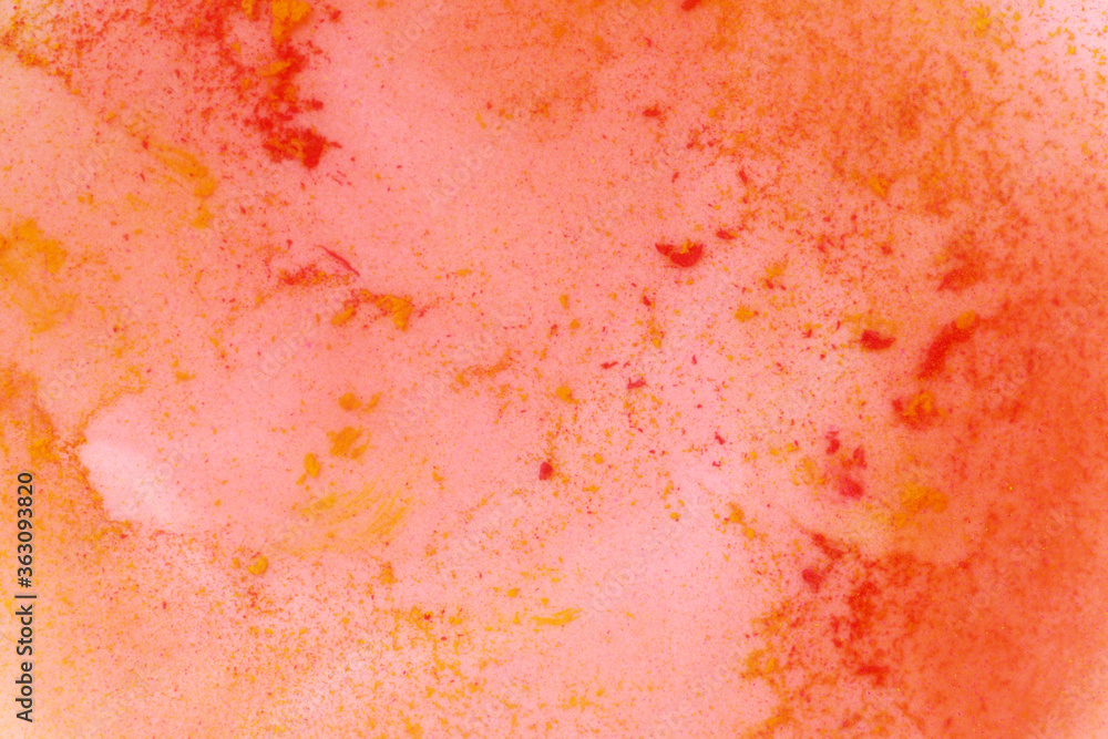 yellow and red paint in water