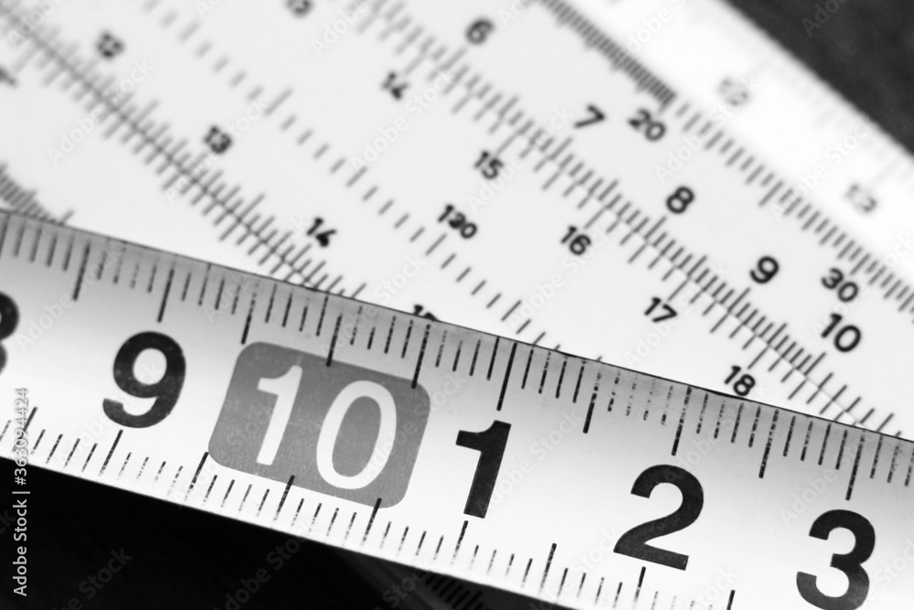 Measuring tool and tape measure, black and white Measuring tool and tape measure, black and white