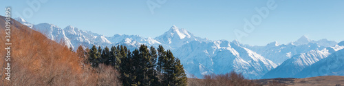 Mountain peaks snow covered mountain range with blue sky
