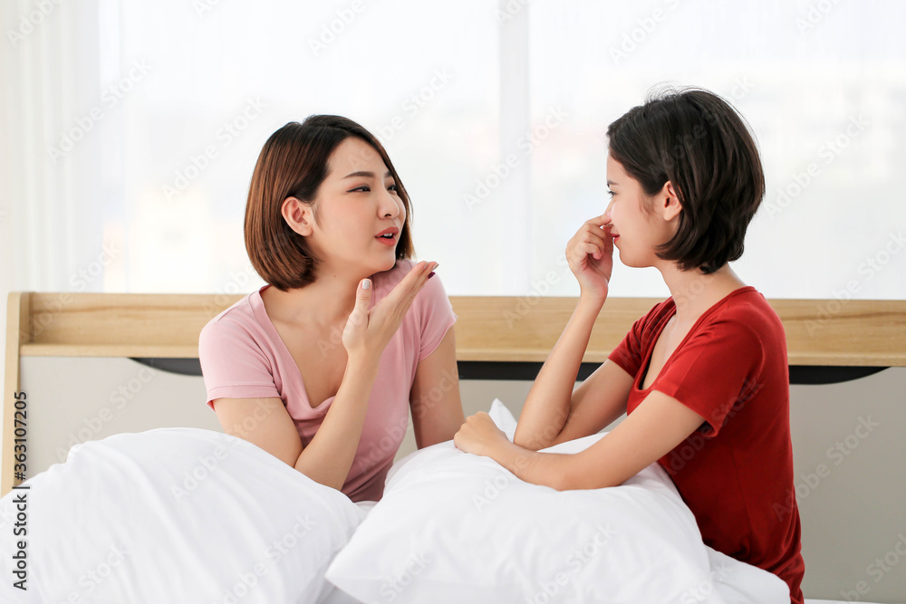 Happy Couple asia woman bored with bad breath in bedroom morning. Happy Couple asia woman bored with bad breath in bedroom morning.