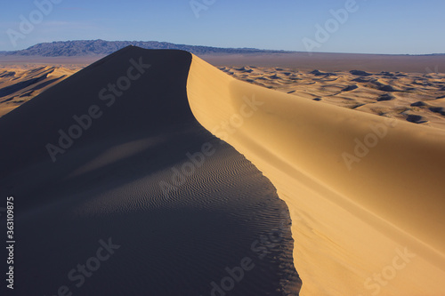 Great Khongorin sand dune and mountains in Gobi desert, Mongolia